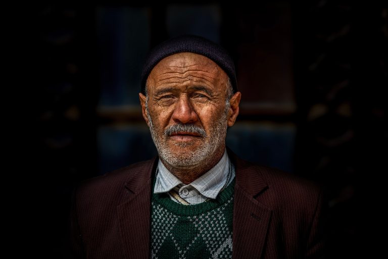 Close-up portrait of a senior man in Markazi Province, Iran, showcasing character and culture.